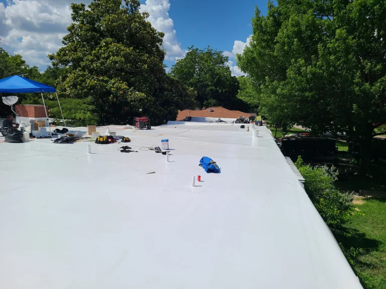 Residential flat roof finished with a white reflective membrane