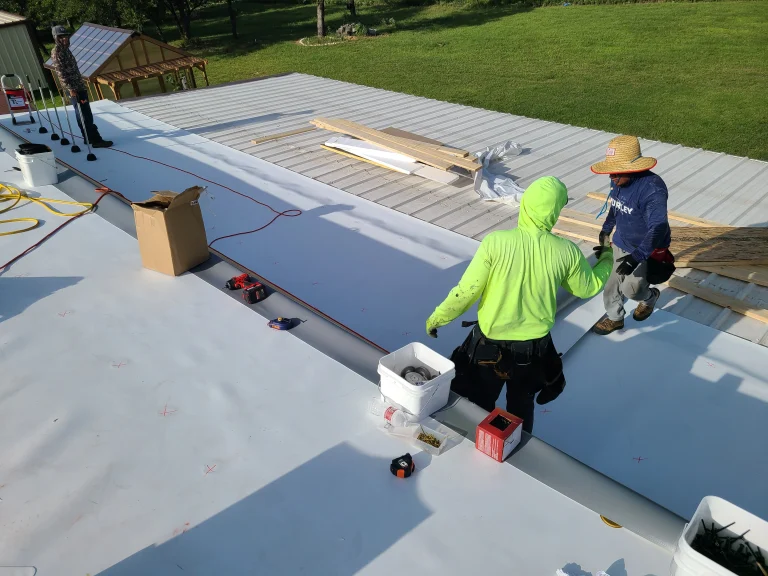 Texcore roofing crew detailing a skylight curb on a commercial TPO roof